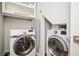 Laundry room with washer, dryer, and ironing board at 1216 E Rock Springs Ne Rd, Atlanta, GA 30306