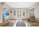 Bright living room featuring a beach view on TV, french doors, and an office area at 1216 E Rock Springs Ne Rd, Atlanta, GA 30306