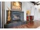 Stylish fireplace with unique stone design and hardwood floors, creating a cozy ambiance at 1216 E Rock Springs Ne Rd, Atlanta, GA 30306
