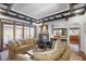Inviting living room features a fireplace, dark trim, hardwood floors, and access to the backyard at 1216 E Rock Springs Ne Rd, Atlanta, GA 30306