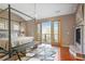 Bright bedroom with modern decor features a fireplace and balcony with outdoor views at 1216 E Rock Springs Ne Rd, Atlanta, GA 30306