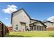 The exterior backyard with a screened in porch at 1314 Bentley Estates Dr, Dacula, GA 30019