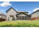 The exterior backyard with a screened in porch at 1314 Bentley Estates Dr, Dacula, GA 30019