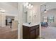 Well-lit bathroom with modern vanity, mirror, and ample storage space at 1314 Bentley Estates Dr, Dacula, GA 30019