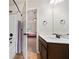 Inviting bathroom with shower and bathtub combo adjacent to the bedroom at 1314 Bentley Estates Dr, Dacula, GA 30019