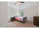 Cozy bedroom with neutral walls, carpet, ceiling fan, and a window with natural light at 1314 Bentley Estates Dr, Dacula, GA 30019