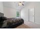 Cozy bedroom features neutral carpet, large window, and a spacious closet at 1314 Bentley Estates Dr, Dacula, GA 30019