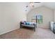 Bright bedroom with carpet, ceiling fan, vaulted ceiling, and window at 1314 Bentley Estates Dr, Dacula, GA 30019
