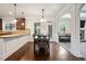 Bright dining area with hardwood floors, wainscotting, and access to a living space at 1314 Bentley Estates Dr, Dacula, GA 30019