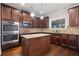 Gourmet kitchen with stainless steel appliances, center island, and ample cabinet space at 1314 Bentley Estates Dr, Dacula, GA 30019