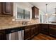 Well-equipped kitchen with stainless steel dishwasher, and granite countertops at 1314 Bentley Estates Dr, Dacula, GA 30019