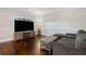 Cozy living room with hardwood floors, wainscotting, and a comfortable couch at 1314 Bentley Estates Dr, Dacula, GA 30019