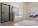 Spa-like main bathroom features a glass enclosed shower and separate soaking tub at 1314 Bentley Estates Dr, Dacula, GA 30019