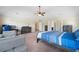 Large main bedroom features a seating area, desk, and and closets at 1314 Bentley Estates Dr, Dacula, GA 30019