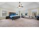 Spacious main bedroom with vaulted ceilings, fan, and lots of natural light at 1314 Bentley Estates Dr, Dacula, GA 30019