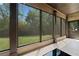 Inviting screened porch with outdoor view at 1314 Bentley Estates Dr, Dacula, GA 30019