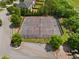 Aerial view of tennis courts with a playground, surrounded by trees and green space at 1314 Bentley Estates Dr, Dacula, GA 30019