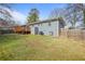 Spacious backyard with a deck, patio, shed, and green lawn at 2222 Hill Nw St, Atlanta, GA 30318