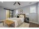 Comfortable bedroom with ceiling fan, wood-look floors, and a large window for ample natural light at 2222 Hill Nw St, Atlanta, GA 30318
