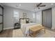 Stylish bedroom featuring a ceiling fan, neutral walls, and a bed with decorative pillows at 2222 Hill Nw St, Atlanta, GA 30318