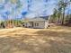 Lush greenery surrounds the home in the backyard, providing ample space for outdoor activities and recreation at 5096 Cumberland Ct, Villa Rica, GA 30180