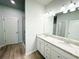 Bathroom with double sink vanity, granite countertops, and a walk-in shower at 5096 Cumberland Ct, Villa Rica, GA 30180