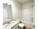 Well-lit bathroom featuring a vanity with granite countertop and a shower-tub combo at 5096 Cumberland Ct, Villa Rica, GA 30180