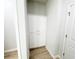 Bathroom with storage cabinet and wood-look floors at 5096 Cumberland Ct, Villa Rica, GA 30180