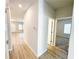 Hallway showcasing the light-filled interior, featuring durable flooring and access to bedrooms at 5096 Cumberland Ct, Villa Rica, GA 30180