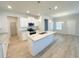Bright, open kitchen with stainless appliances, granite countertops and a kitchen island at 5096 Cumberland Ct, Villa Rica, GA 30180