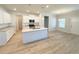Modern kitchen with white cabinets, granite countertops, and stainless steel appliances at 5096 Cumberland Ct, Villa Rica, GA 30180
