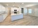 Open kitchen with a central island, stainless steel appliances, and a dining area at 5096 Cumberland Ct, Villa Rica, GA 30180