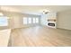 Expansive living room with hardwood floors, fireplace, and lots of natural light at 5096 Cumberland Ct, Villa Rica, GA 30180