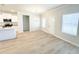 Open-concept living area with modern flooring and bright windows adjoining dining area at 5096 Cumberland Ct, Villa Rica, GA 30180