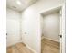 Hallway featuring tile floors and a door to the laundry room for added convenience at 5096 Cumberland Ct, Villa Rica, GA 30180