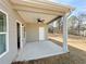Covered patio features recessed lighting and a ceiling fan, ideal for outdoor entertaining or relaxation at 5096 Cumberland Ct, Villa Rica, GA 30180