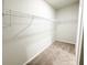 Spacious walk-in closet with carpet floors and wire shelving at 5096 Cumberland Ct, Villa Rica, GA 30180