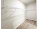 Spacious walk-in closet with carpet floors and wire shelving at 5096 Cumberland Ct, Villa Rica, GA 30180