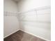 Spacious walk-in closet with carpet floors and wire shelving at 5096 Cumberland Ct, Villa Rica, GA 30180