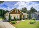 Charming home with a well-manicured lawn, mature landscaping, and inviting curb appeal at 608 Red Leaf Way, Canton, GA 30114