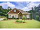 Charming single-Gathering home showcasing a manicured lawn and welcoming front exterior at 608 Red Leaf Way, Canton, GA 30114