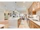 Open kitchen with stainless steel appliances and plenty of counter space at 608 Red Leaf Way, Canton, GA 30114