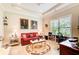 Cozy living room with plush seating, ceiling fan and natural light at 608 Red Leaf Way, Canton, GA 30114