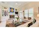 Bright living room featuring a fireplace, built-in shelving, and comfortable seating with colorful accents at 608 Red Leaf Way, Canton, GA 30114