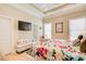 Comfortable main bedroom with natural light and modern television at 608 Red Leaf Way, Canton, GA 30114