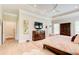 Bright main bedroom with tray ceilings, wood floors, and a view of a television at 608 Red Leaf Way, Canton, GA 30114