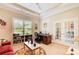 Bright office space with built-in shelving, french doors and comfortable furnishings at 608 Red Leaf Way, Canton, GA 30114