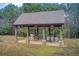 Covered pavilion with stone supports, BBQ grill and outdoor dining set at 608 Red Leaf Way, Canton, GA 30114