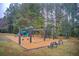 Community playground features swings, slides, and benches for Gathering fun in a natural setting at 608 Red Leaf Way, Canton, GA 30114