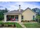 Charming backyard with a covered patio, well-maintained lawn, and privacy fencing, perfect for outdoor living at 608 Red Leaf Way, Canton, GA 30114